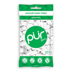 Close-up of single PUR Gum spearmint piece showing smooth texture and fresh flavor
