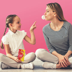 PUR Jumbo Gum piece beside a regular chiclet demonstrating three times the size for longer chew