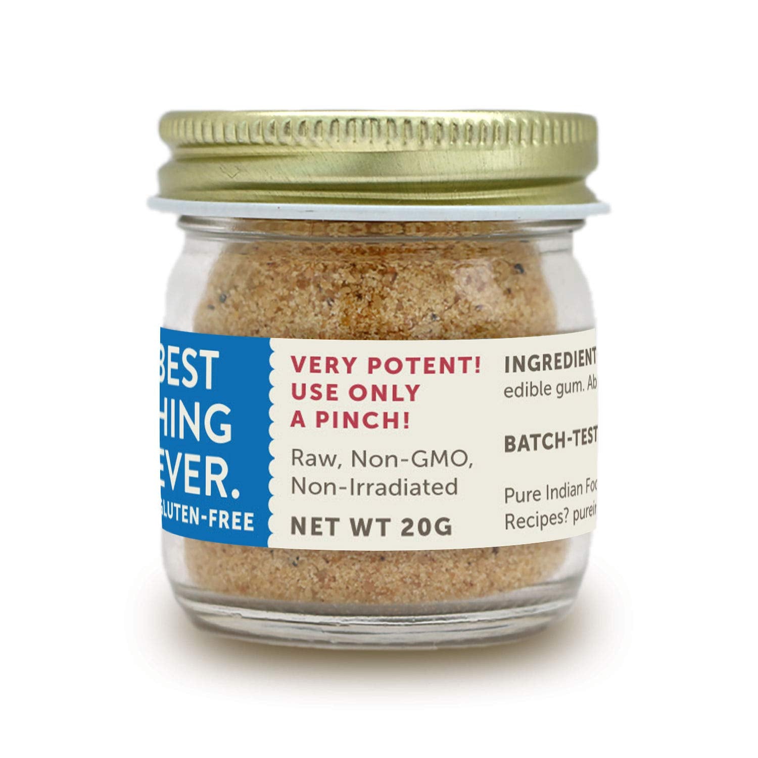 PURE INDIAN FOODS jar opened with a pinch on a spoon demonstrating easy dispensing
