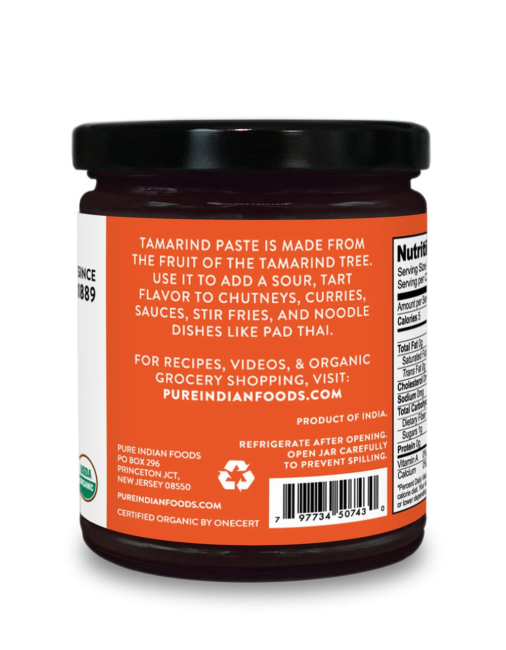PURE INDIAN FOODS spoonful of paste over bowl, demonstrates portioning convenience