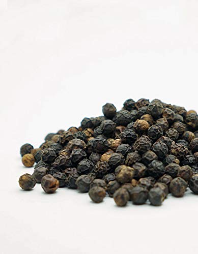 PURE INDIAN FOODS close-up of Tellicherry berries highlighting texture and aroma