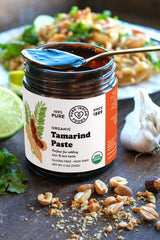 PURE INDIAN FOODS close-up pouring paste, shows texture and easy integration into sauces