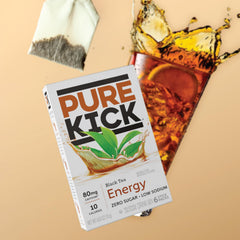 PURE KICK beside water bottle for scale comparison, demonstrates travel-friendly size