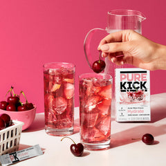 PURE KICK packet beside 16.9 fl oz bottle illustrating portion size