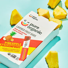 Pure Organic with fresh pineapple and passionfruit highlighting natural ingredients