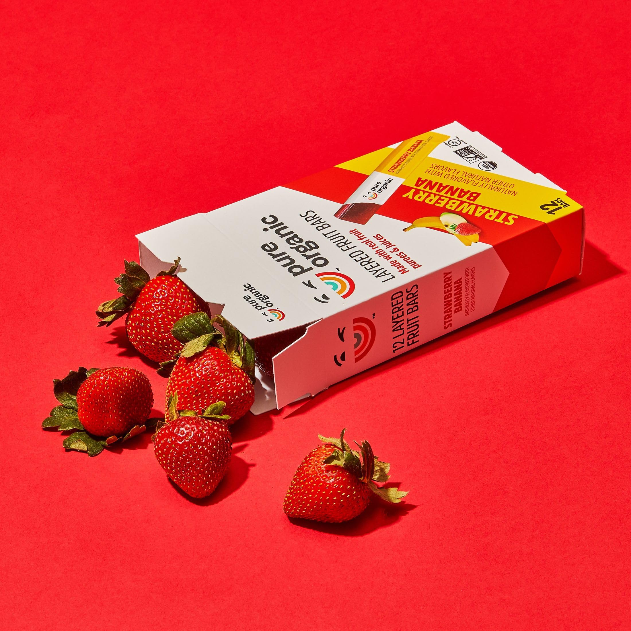 Pure Organic bar beside an apple to show compact snack size
