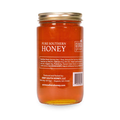 Pure Southern Honey pouring from jar showing thick raw unfiltered flow