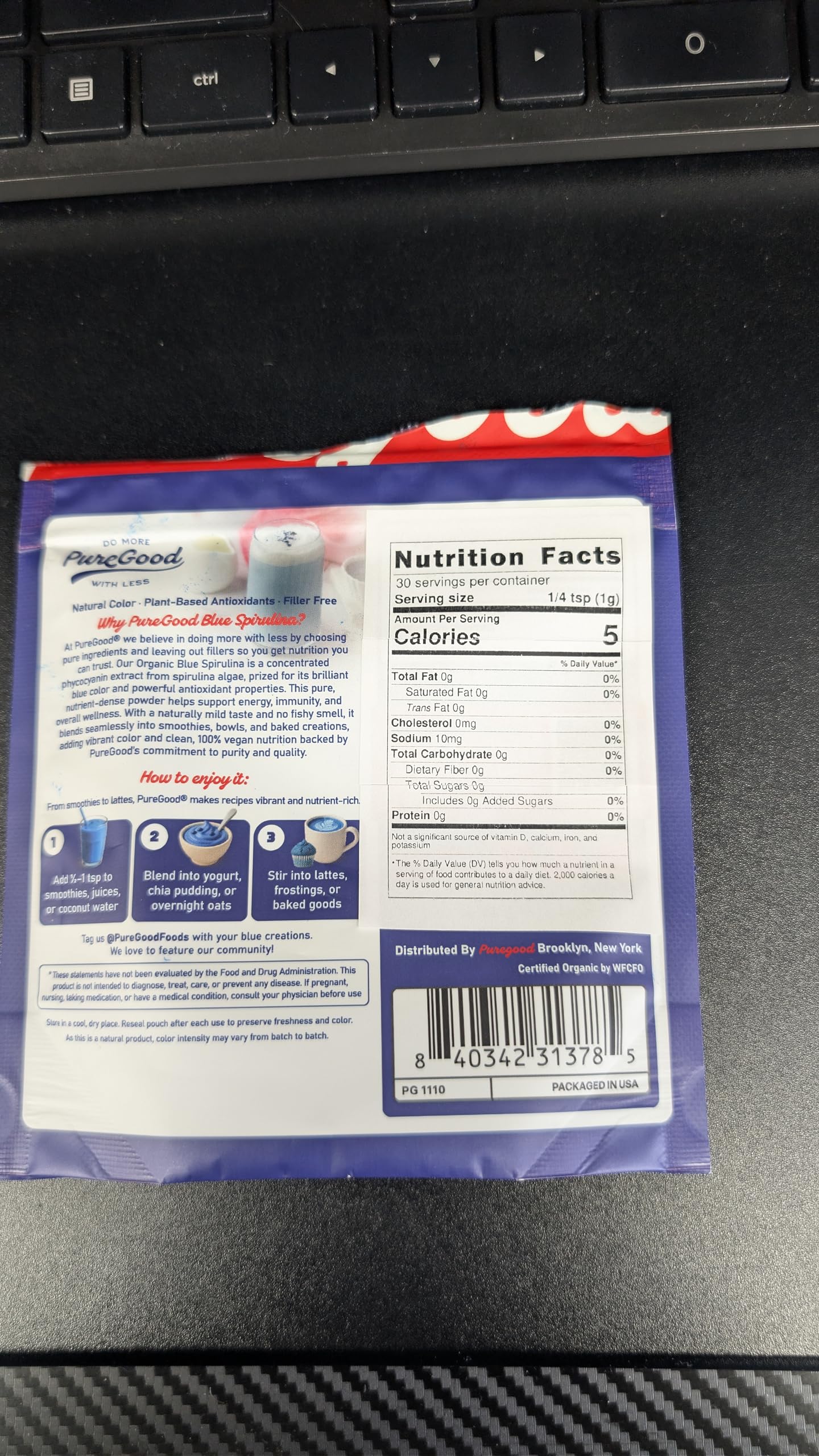 Measured teaspoon of PureGood blue spirulina showing portion control and ease