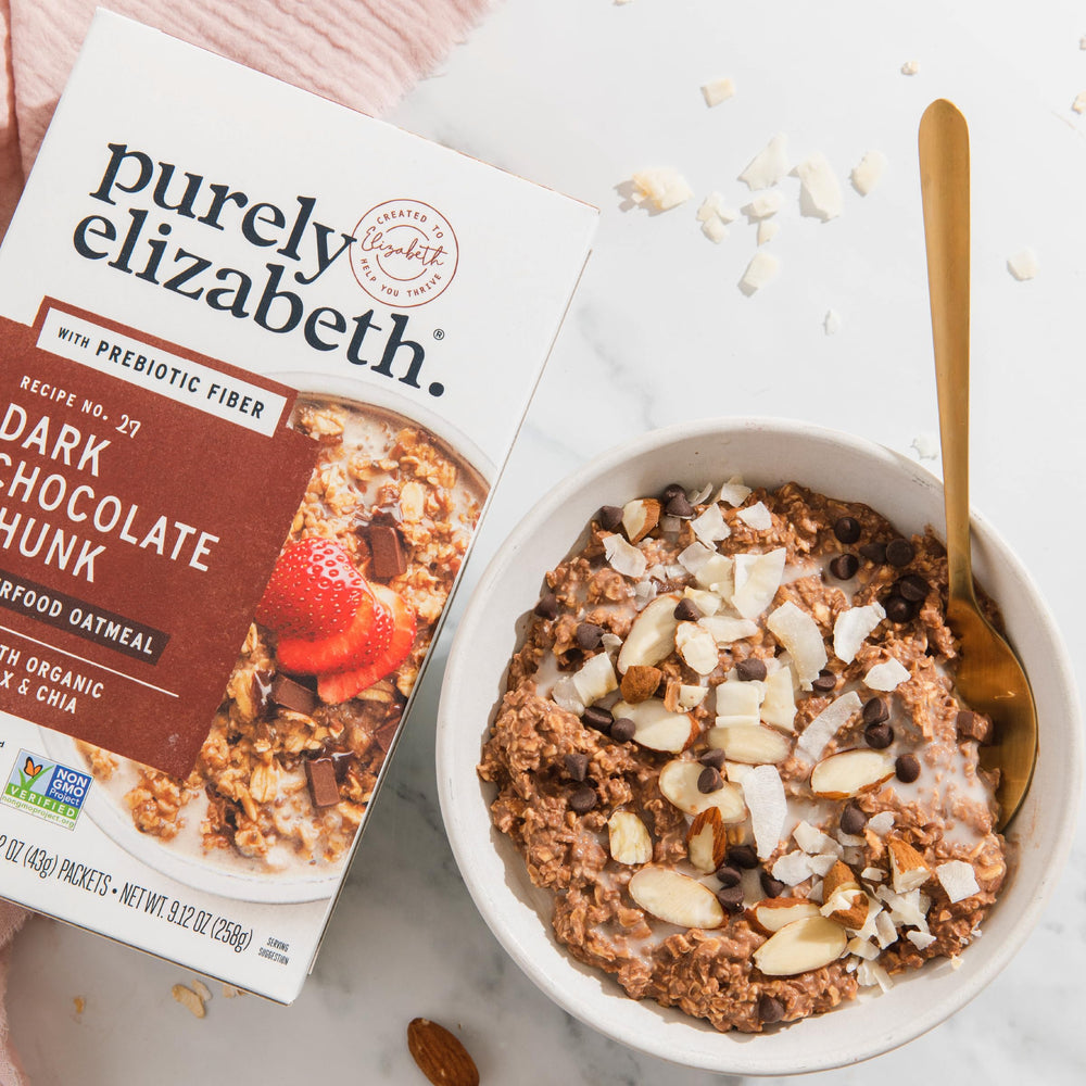 Purely Elizabeth served bowl with fruit and nuts showcasing flavorful, balanced breakfast