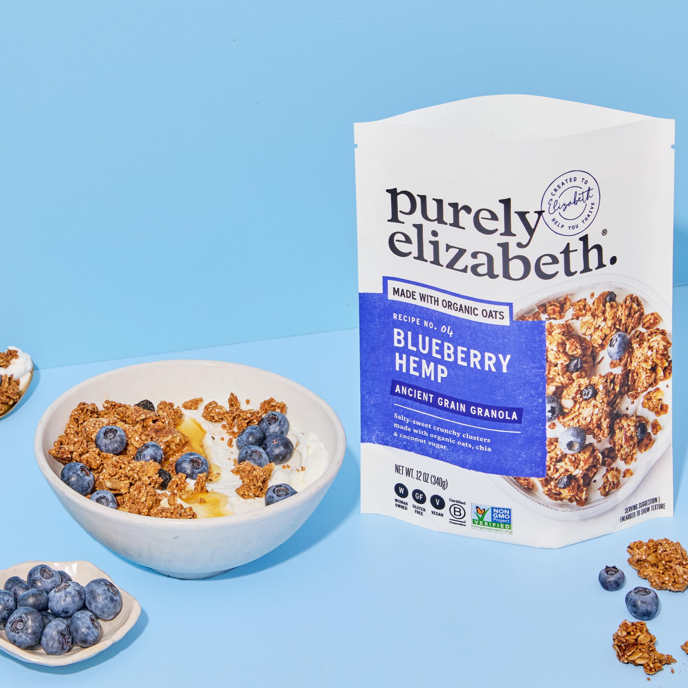 purely elizabeth hand holding bag for scale highlights portion benefit for on-the-go snacking
