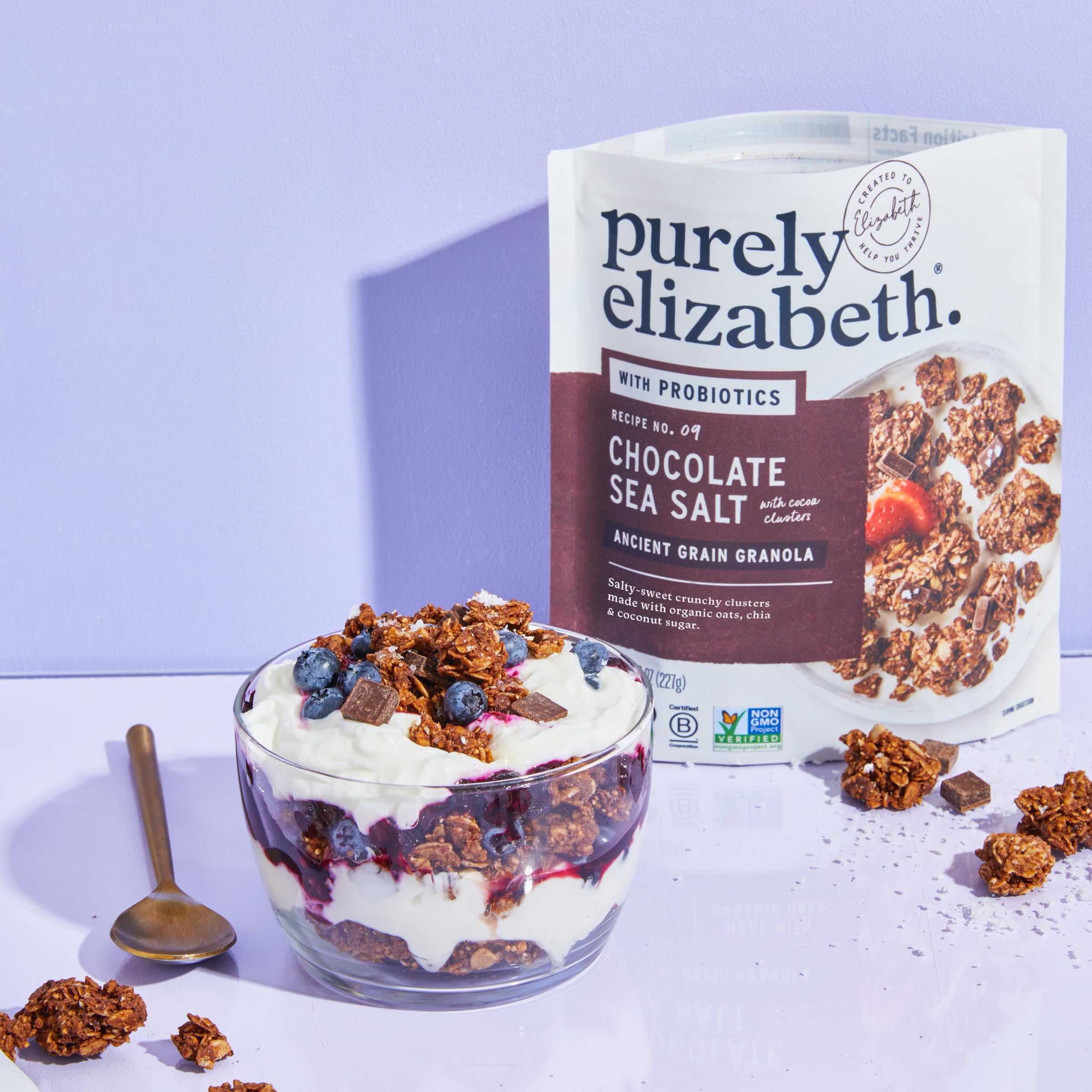 purely elizabeth granola beside a spoon to show portion scale and convenience
