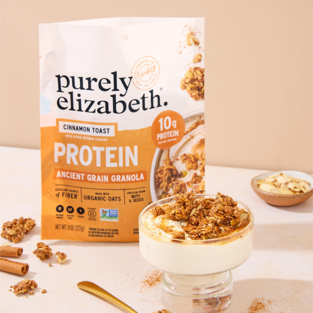 purely elizabeth spoonful over yogurt showing added protein and satisfying crunch