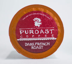 Puroast pod beside coins showing compact single-serve size and convenience