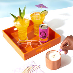 Q MIXERS pouring ginger beer into a cocktail glass to preserve fizz
