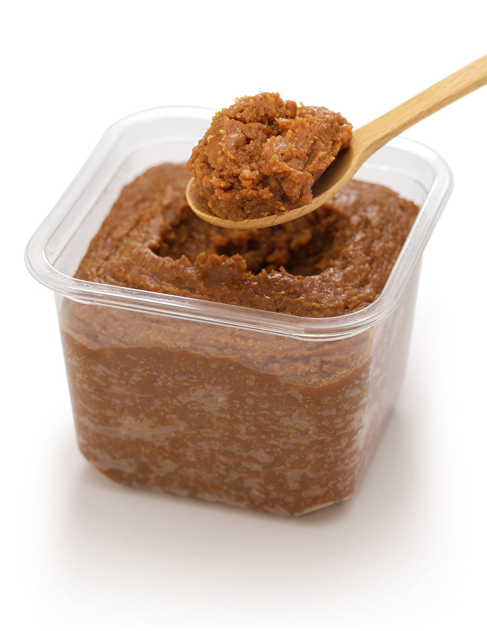 Q-Rapha spoonful over steaming stew demonstrating concentrated flavor boost