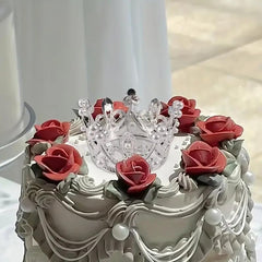 Qhinaster cupcake arrangement with crowns creating a cohesive party dessert look