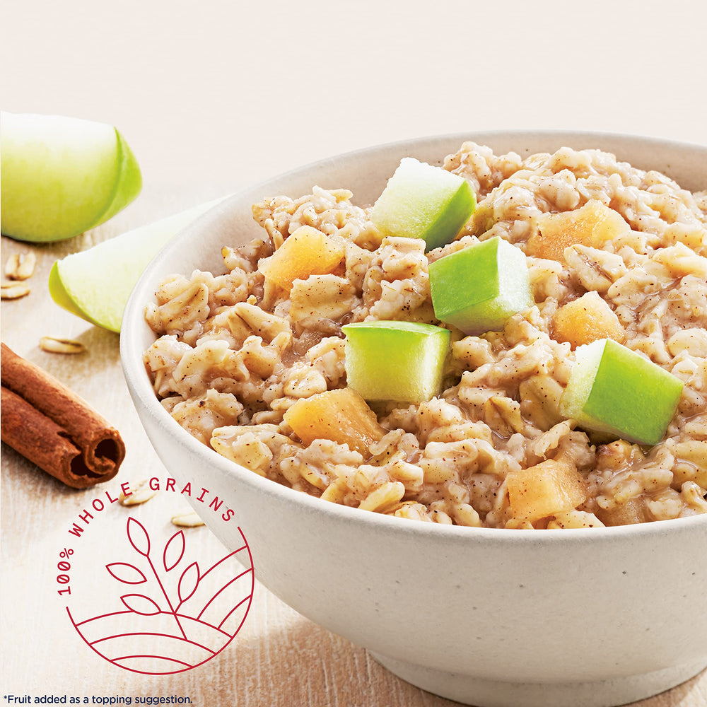 Close-up of a Quaker packet with visible apple pieces and oats highlighting flavor