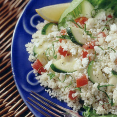 Quaker Near East tabouleh served on a plate with tomato and lemon, ready-to-eat refreshing side