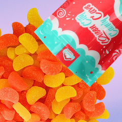 QUEEN CITY CANDY CAVE close-up of sugar-coated texture on lemon and orange slices, vivid flavor appeal