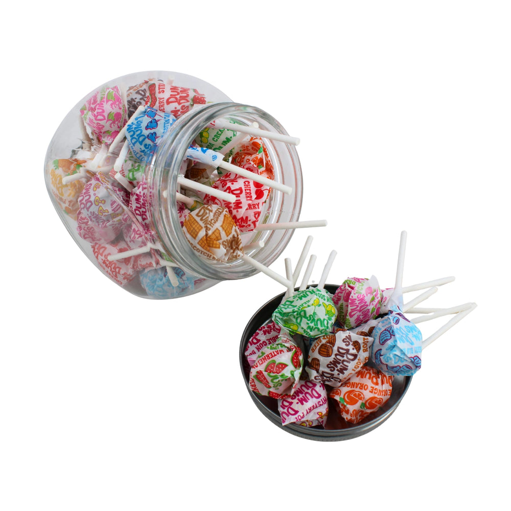 QUEEN CITY CANDY CAVE Dum Dums next to a ruler for size and serving view