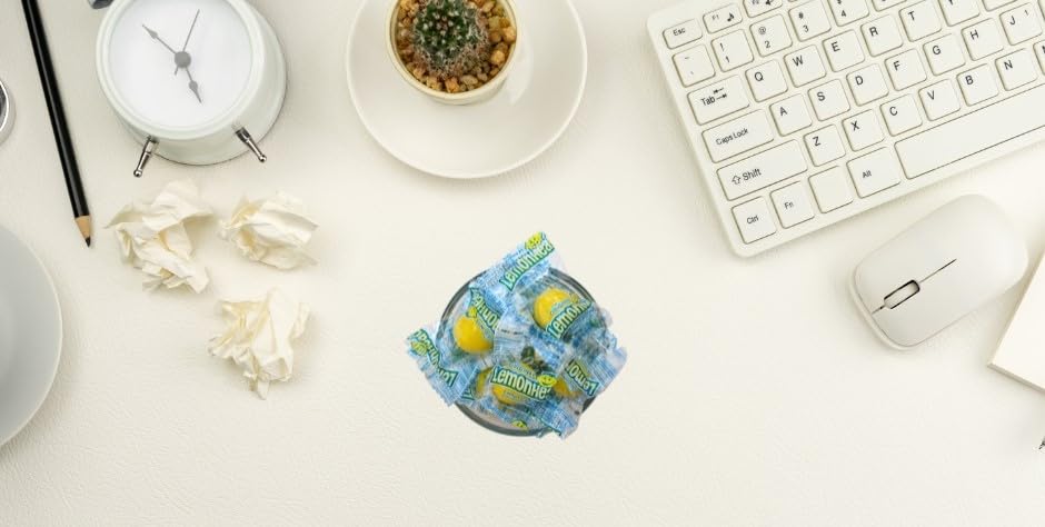 QUEEN CITY CANDY CAVE lifestyle scene of snacking at a desk offering quick treat