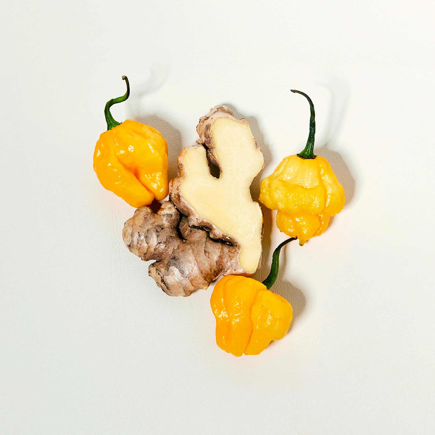 Queen Majesty ingredients spread with peppers and lemon showing natural, no-sugar recipe