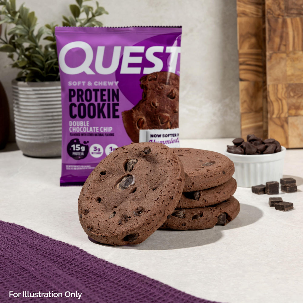Quest cookie beside a glass of milk highlighting enjoyable pairing