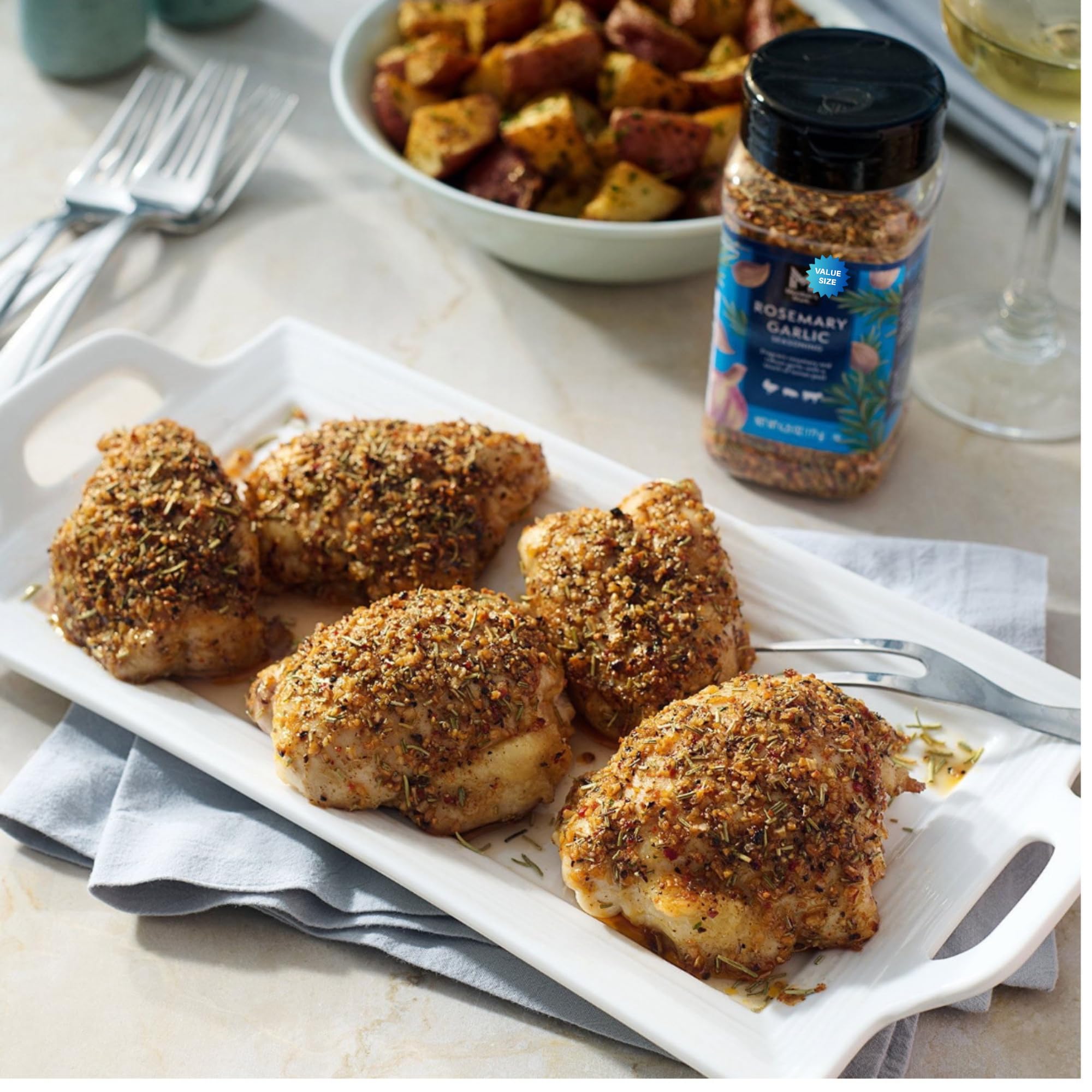 R&C Store Essentials seasoning in use on roasted chicken at a dinner table, boosting aroma and flavor