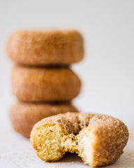 Rabbit Creek donut on a plate with coffee in kitchen setting conveys cozy homemade breakfast