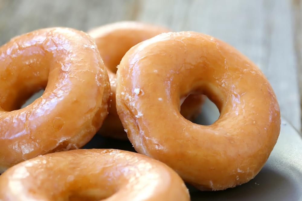 Rabbit Creek donuts baking in a donut pan demonstrating even rise and convenient oven baking
