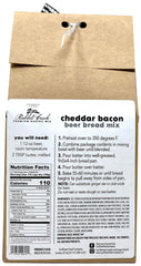 Rabbit Creek sliced loaf on wooden board, highlights soft crumb and cheese