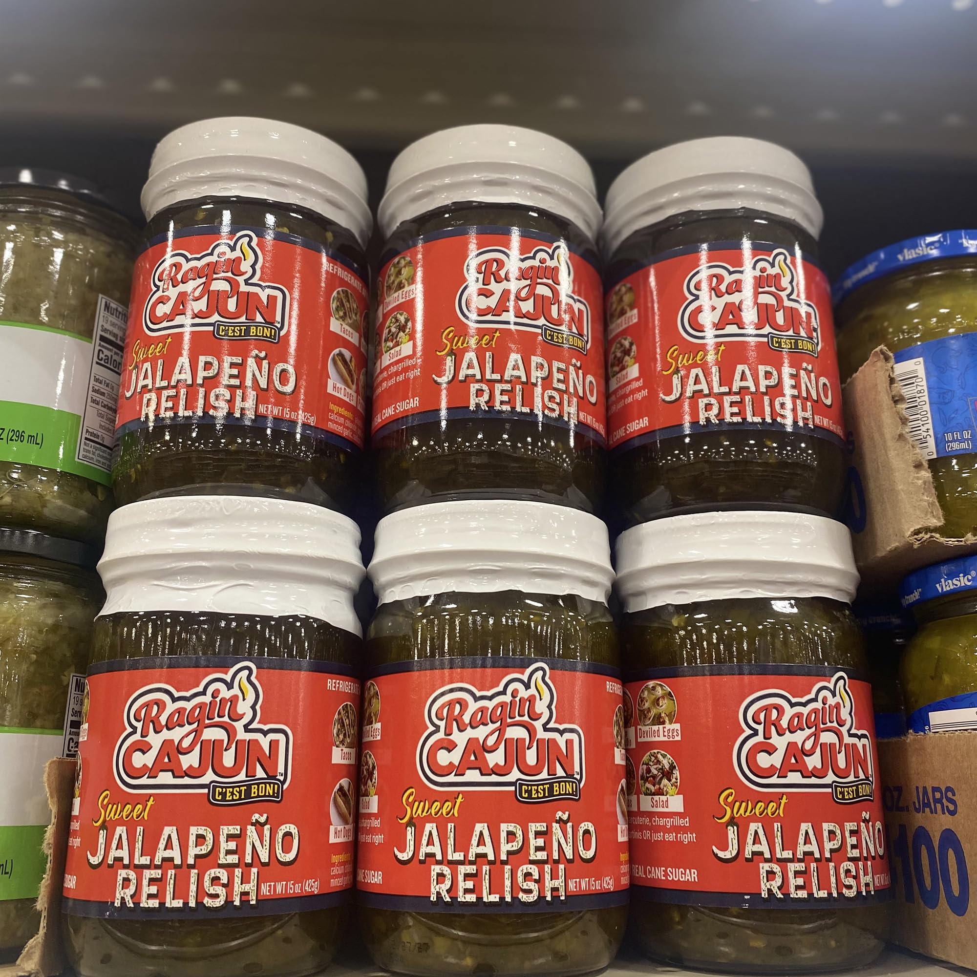 Ragin' Cajun raw jalapeño and garlic ingredients displayed, communicates freshness