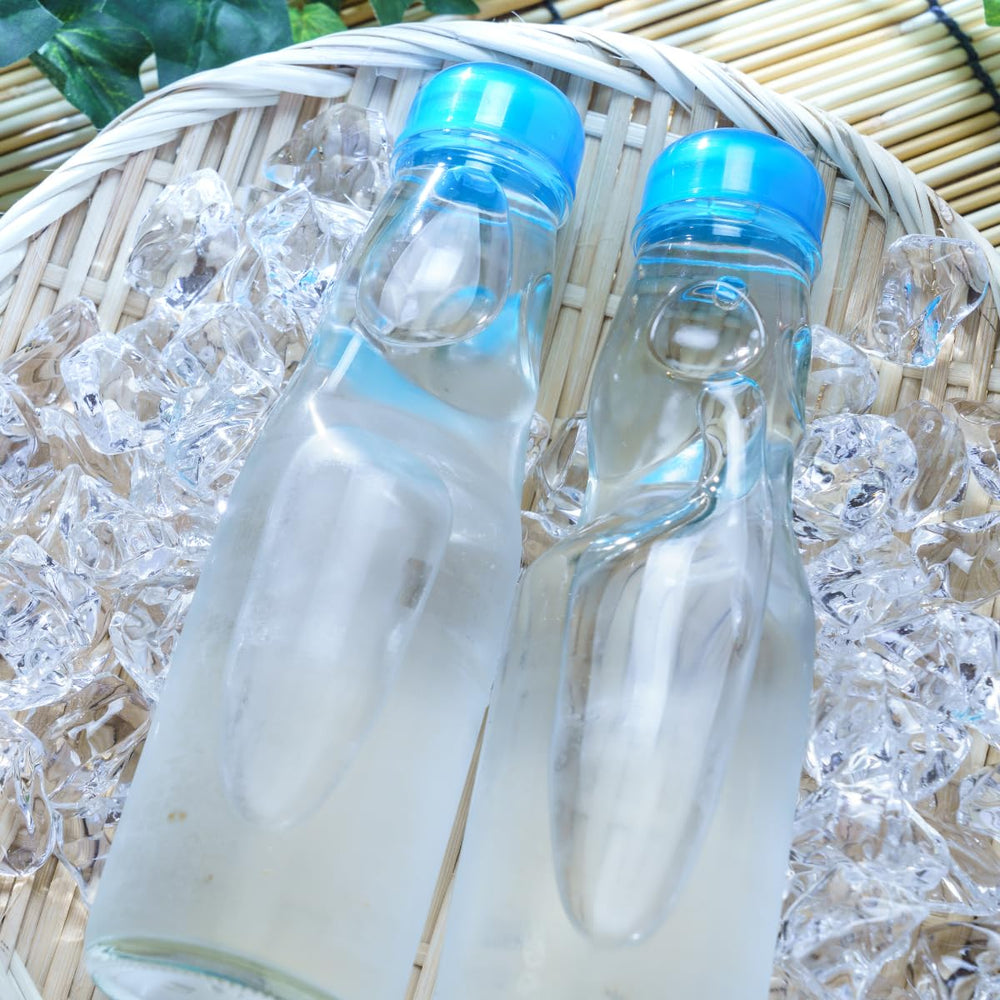 Generic Ramune held in hand to show bottle scale and portability benefit