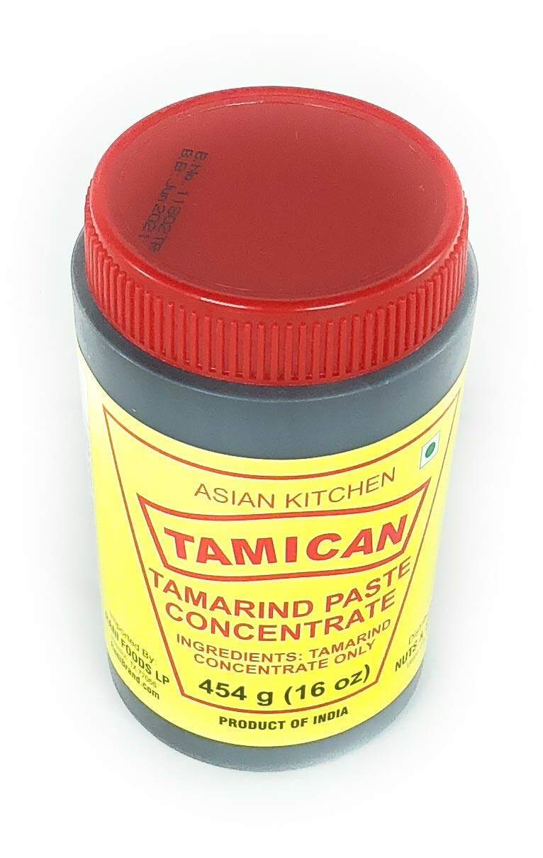 Rani tamarind concentrate size comparison beside spoon to show jar capacity