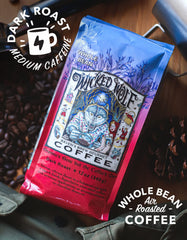 Raven's Brew Wicked Wolf whole beans close-up showing rich texture and aroma
