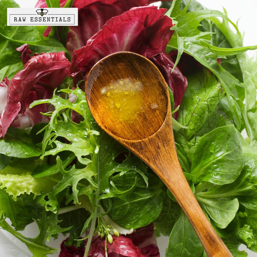 Raw Essentials powder mixed into vinaigrette demonstrating quick dissolution