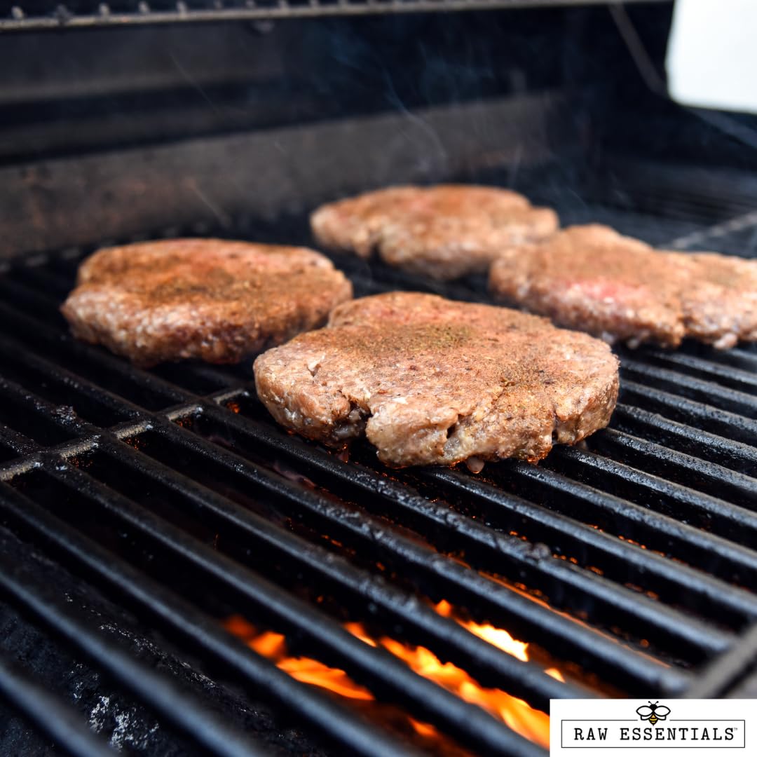 Raw Essentials rubbed steak on grill highlighting smoky sear and enhanced flavor