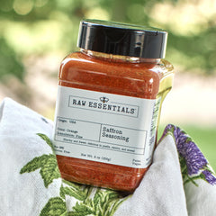 Raw Essentials seasoning poured over rice showing vibrant color enhancement
