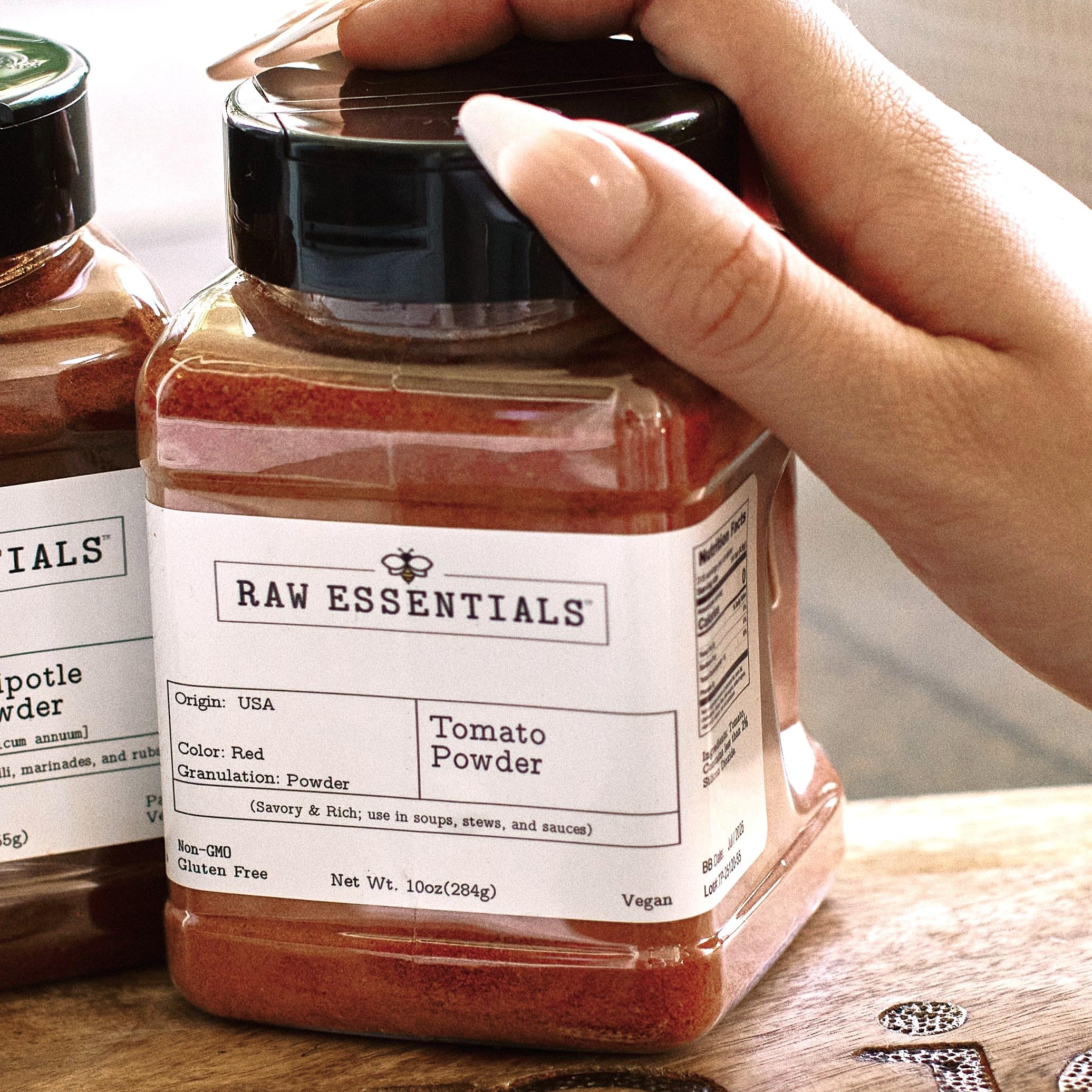 Raw Essentials bottle beside a ruler showing compact 10 oz pantry size