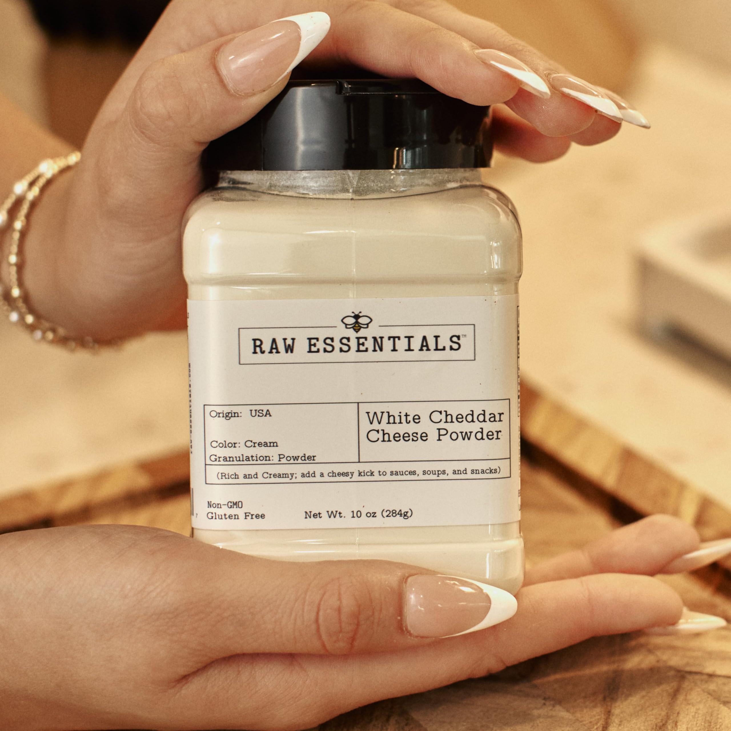 Raw Essentials bottle next to a measuring cup to show 10 oz size