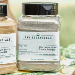 Raw Essentials powder pouring from shaker into hand, easy-to-dispense seasoning