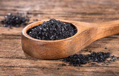 Raw Garden salt sprinkled on steak enhancing flavor and visual contrast