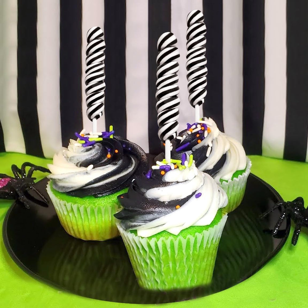 RBBZ Party styled candy buffet with black suckers creating bold contrast and elegant display