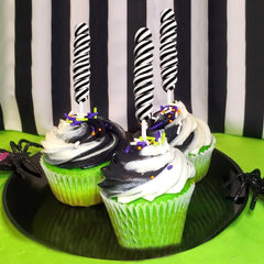 RBBZ Party styled candy buffet with black suckers creating bold contrast and elegant display