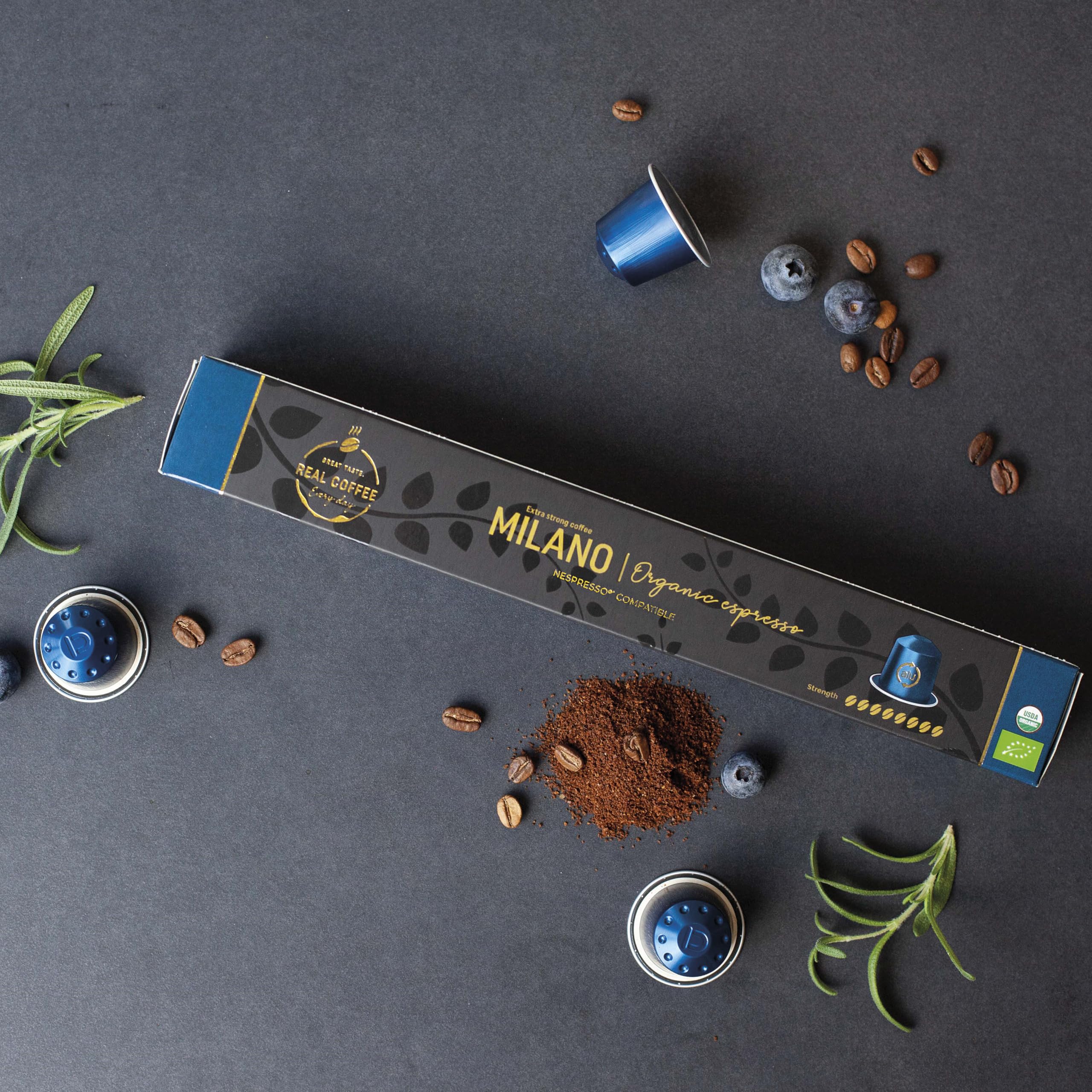 REAL COFFEE GREAT TASTE Milano capsule closeup highlighting aluminium shell and freshness preservation
