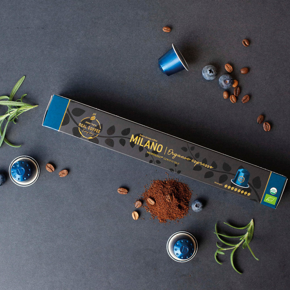 REAL COFFEE GREAT TASTE Milano capsule closeup highlighting aluminium shell and freshness preservation