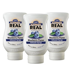 Reàl Infused Exotics front packaging showing three blueberry syrup bottles and bright label benefit quick service