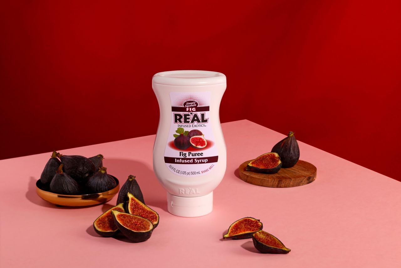 Reàl Infused Exotics bottle held in hand to show scale and easy squeeze control
