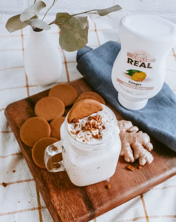 Reàl Infused Exotics syrup on a spoon showing smooth texture and consistent mixability