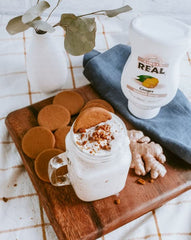 Reàl Infused Exotics syrup on a spoon showing smooth texture and consistent mixability